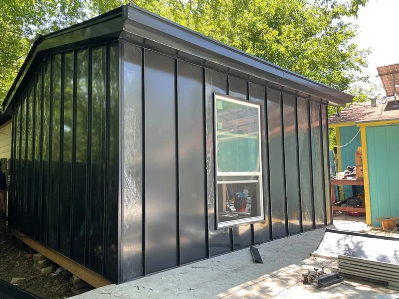 Black standing seam metal wall panels for Metal Roof Installation in Santa Teresa