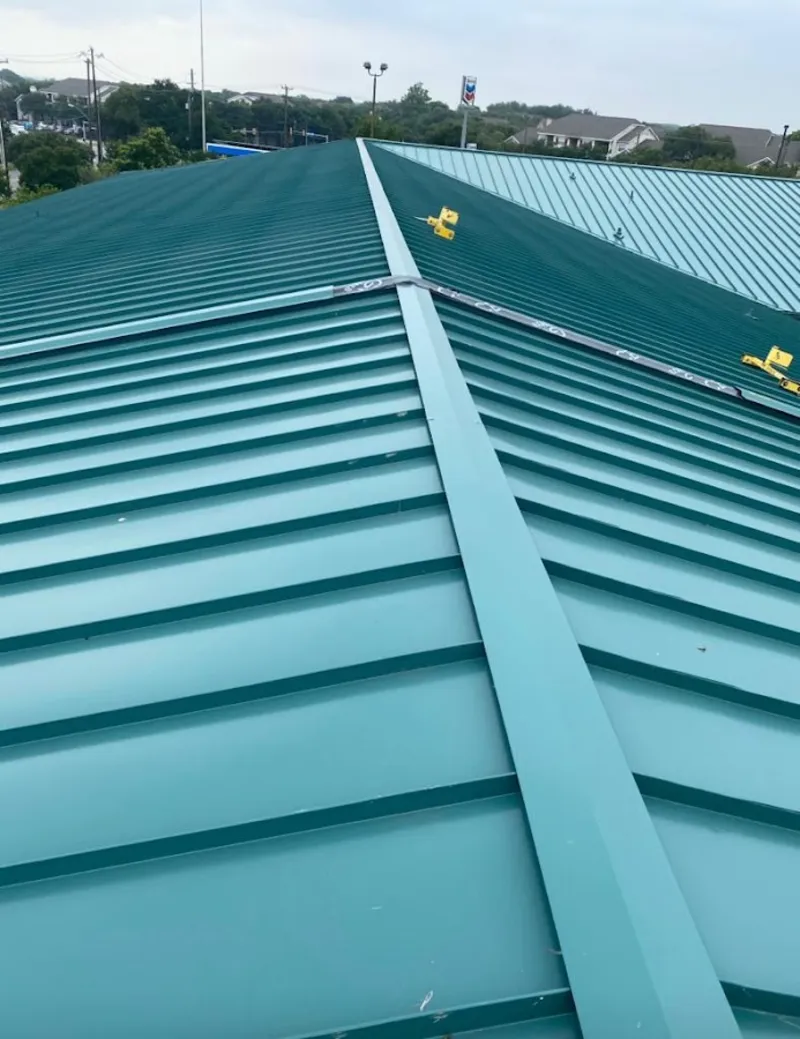 Green commercial metal roof ridge and valley for Metal Roof Repair in Santa Teresa