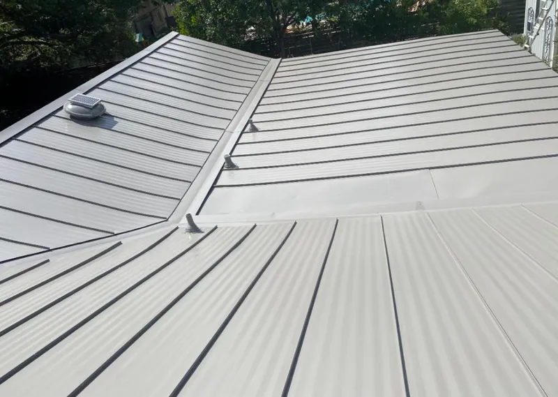 Solar attic fan installed on a metal roof for Roof Ventilation in Santa Teresa